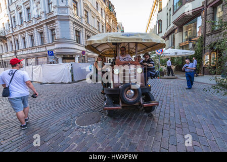 Party bike (also called cycle pub, beer bike or megacycle) on the Old Town of Riga, capital city of Republic of Latvia Stock Photo