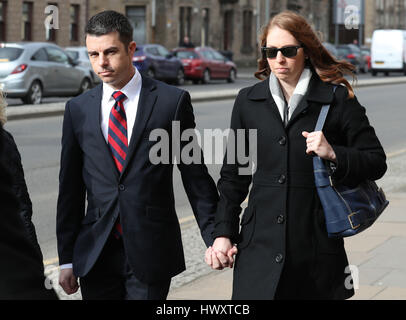 RETRANSMITTED AMENDING TOPIC AND KEYWORD AND ADDING SENTENCING American airline pilot Paul Brady Grebenc, 35, arrives with his wife Emily (right), at Paisley Sheriff Court, where he was jailed for 10 months after he admitted preparing to fly a passenger jet while more than twice the legal alcohol limit. Stock Photo