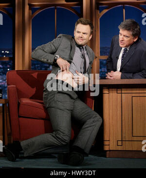 Comic Joel McHale, left, shows off his bed bug bites that he got at a New York hotel to host Craig Ferguson during a segment of 'The Late Late Show with Craig Ferguson' at CBS Television City in Los Angeles on Friday, Dec. 12, 2008. Photo by Francis Specker Stock Photo