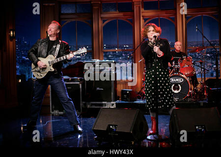 The punk band, 'X', with band members Exene Cervenka, DJ Bonebrake on drums, and Billy Zoom on guitar, perform  during a segment of 'The Late Late Show with Craig Ferguson' at CBS Television City on Oct. 27, 2008 in Los Angeles, California. Photo by Francis Specker Stock Photo