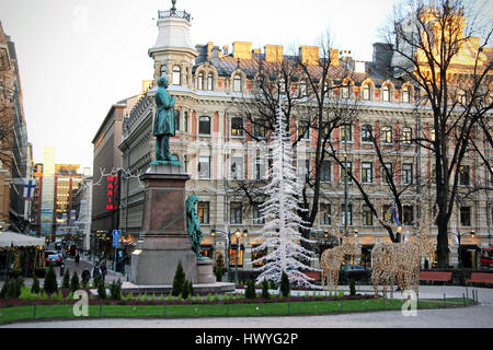 HELSINKI, FINLAND - DECEMBER 8, 2016: Statue of the Finnish National Poet Johan Ludvig Runeberg on Esplanadi Park among Christmas decorations in Helsi Stock Photo