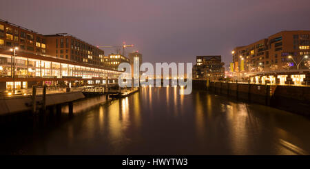 Germany, Hamburg, HafenCity, Elbarkaden and Elbtorpromenade at Magdeburger Hafen by twilight Stock Photo
