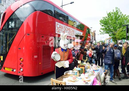 CAMDEN HIGH STREET LONDON  ENGLAND  5 May  2015:  Mad Hatters Tea Party on street Stock Photo