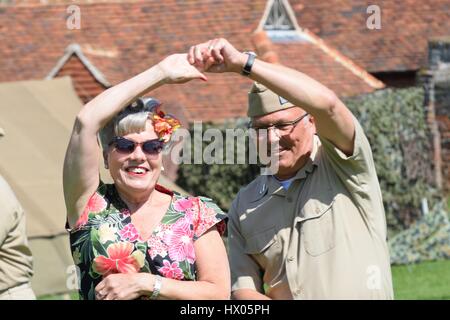 CRESSING TEMPLE ENGLAND 17 May 2015: Senior couple in costume jiving Stock Photo