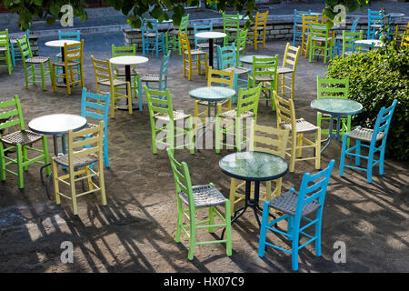 Tables and chairs of a traditional coffee bar in the city of Konitsa in Epirus, Greece Stock Photo
