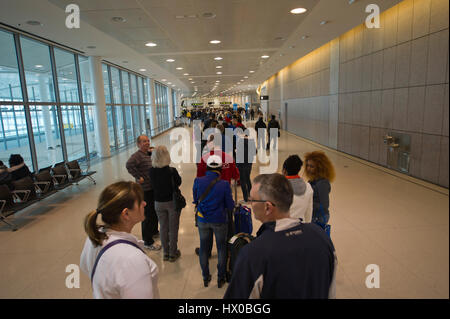 Very long line-up of people departing for Caribbean vacations at security check at Pearson Airport, Toronto Stock Photo