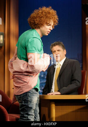 Comic Carrot Top (Scott Thompson), left, show host Craig Ferguson his muscles during a segment of 'The Late Late Show with Craig Ferguson' at CBS Television City on April 15, 2008 in Los Angeles, California. Photo by Francis Specker Stock Photo