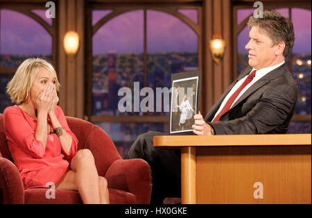 Actress Kristin Chenoweth laughs at a photo of her wearing a New York Mets jersey during a segment of 'The Late Late Show with Craig Ferguson' at CBS Television City on October 29, 2007, in Los Angeles, California. Photo credit: Francis Specker Stock Photo