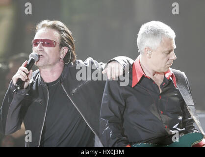 Lead singer of U2, Bono, left, with bass player Adam Clayton  in concert in San Diego, CA on March 28 2005 Photo credit: Francis Specker Stock Photo