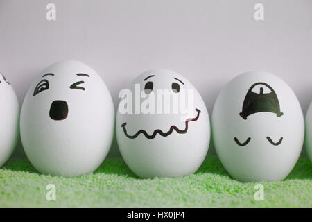 Eggs are cheerful with a face. Three pieces. Concept of fun. Photo for your design Stock Photo