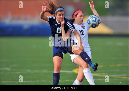 Two opposing players tied each other up while battling for  battled for possession of the ball near midfield. USA. Stock Photo