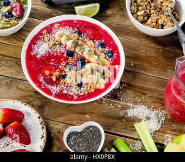 Berry smoothies topped with bananas, blueberries for Healthy breakfast. View from above Stock Photo