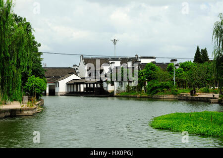 Traditional chinese architecture lining the water canals in the Xitang water town located in in Jiashan County in Jiaxing City, Zhejiang Province chin Stock Photo