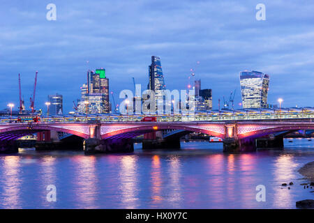 City of London skyl;ine across River Thames at night. Blackfriars Bridge in foreground. Stock Photo