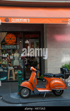 Vespa scooter parked outside a cafe in Degraves Street, a narrow laneway in the Melbourne CBD Stock Photo