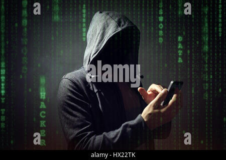 Computer hacker with mobile phone smartphone stealing data Stock Photo