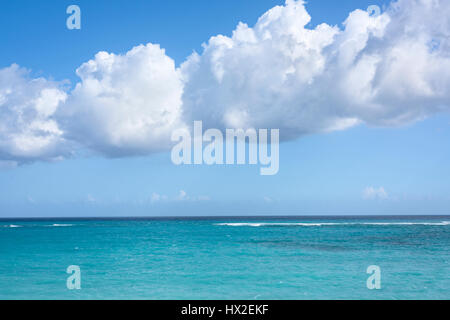 Big white clouds over the Caribbean Sea, tropical seascape, blue sky background Stock Photo