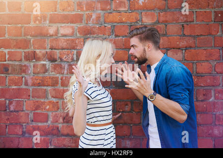 Young couple arguing very loudly Stock Photo