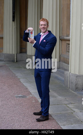 Cyclist Ed Clancy with his OBE after receiving it from the Prince of Wales during an investiture ceremony at Buckingham Palace in London. Stock Photo