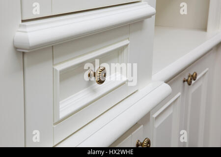 gold handles on cabinet doors Stock Photo