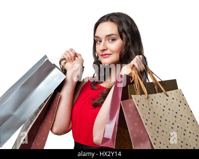 smiling woman in red dress with shopping bags Stock Photo