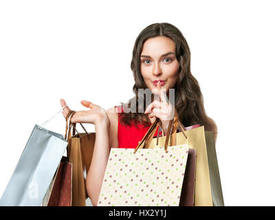 shopping, sale, gifts, christmas, x-mas concept - smiling woman in red dress with shopping bags Stock Photo