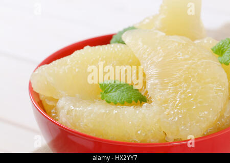 bowl of peeled and sliced pomelo - close up Stock Photo