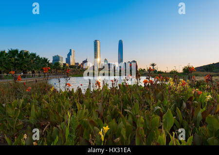 Pond at Bicentennial Park in the wealthy Vitacura district and skyline of buildings at financial district, Santiago de Chile Stock Photo