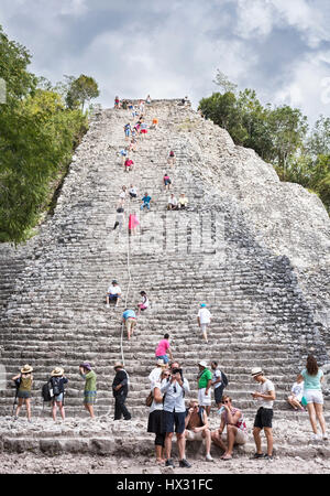 Tourists at the Pyramid Nohoch Mul of the Mayan Coba Ruins, Mexico Stock Photo