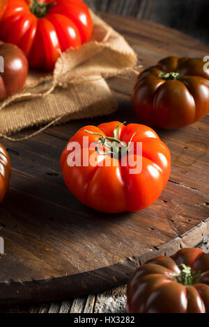 Raw Organic Red and Brown Heirloom Tomatoes Fresh of the Vine Stock Photo