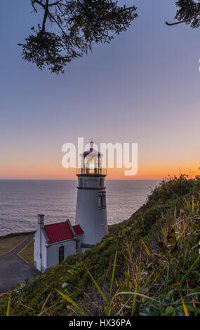 Heceta Head Lighthouse at sunset Stock Photo