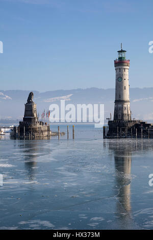 Harbor entrance in winter, Bavarian Lion, New Lighthouse, Lindau, Lake Constance, Bavaria, Germany Stock Photo