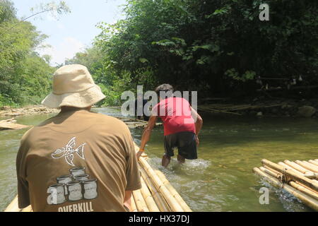 Pushing Raft A start of a bamboo rafting in Phuket. The stream is very calm and ...