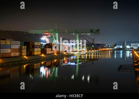 Stuttgart Neckar port in Wangen, at night. Container crane at work in the harbor. Stuttgart, Baden-Wuerttemberg, Germany Stock Photo