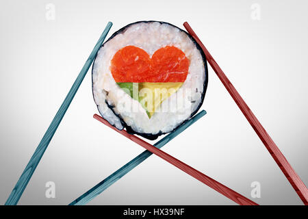 Dinner for two dining and romantic date concept as a couple of chopsticks holding a sushi piece with a love heart shape. Stock Photo