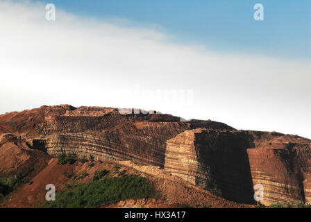 Mountain cliff of red brown colored chinese soil agriculture landscape in the morning. Stock Photo