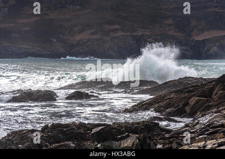 Waves break on Maghera beach rocks near Ardara, County Donegal, Ireland part of Ireland's Wild Atlantic Way Stock Photo