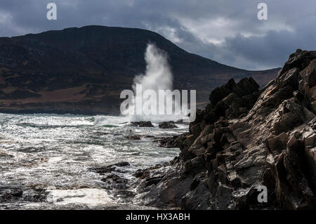 Waves break on Maghera beach rocks near Ardara, County Donegal, Ireland part of Ireland's Wild Atlantic Way Stock Photo