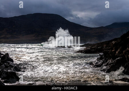 Waves break on Maghera beach rocks near Ardara, County Donegal, Ireland part of Ireland's Wild Atlantic Way Stock Photo