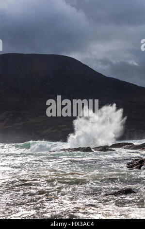 Waves break on Maghera beach rocks near Ardara, County Donegal, Ireland part of Ireland's Wild Atlantic Way Stock Photo