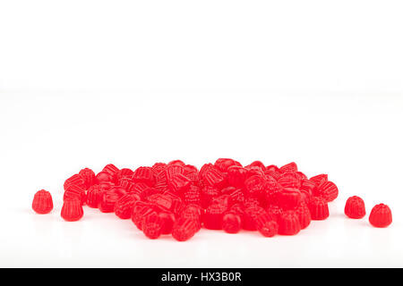 Pile of raspberry jelly candies isolated on white background. Stock Photo