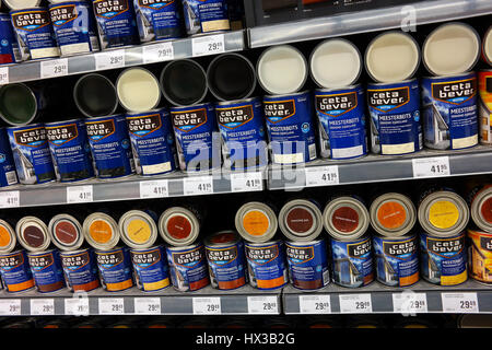Assortment Tins of wood stain in the paint department of a Hardware store Stock Photo