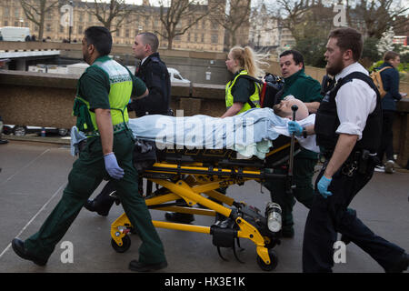 London UK 22 March 2017 A Man injured by a car is brought into St Thomas hospital by Paramedics and police. A police officer has been stabbed near to 