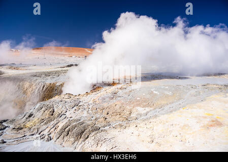 Steaming hot water ponds and mud pots in geothermal region of the Andean Highlands of Bolivia. Roadtrip to the famous Uyuni Salt Flat. Stock Photo