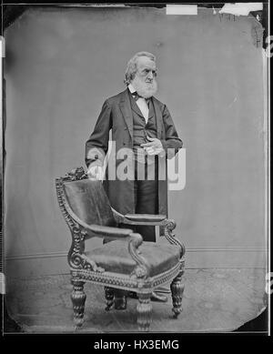Full length portrait of former United States Secretary of the Navy Gideon Welles posing behind a chair, 1863. Image courtesy National Archives. Stock Photo