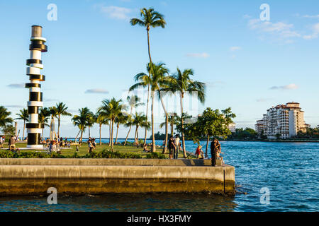 Miami Beach Florida,South Pointe Park,public park,lawn,Art in Public Places,Obstinate Lighthouse,sculpture,Tobias Rehberger,palm trees,waterfront,wate Stock Photo
