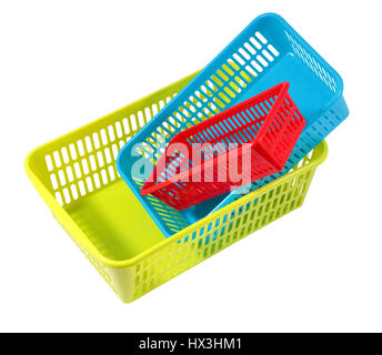 Plastic household articles, colored containers of different sizes, three small storage baskets isolated on white. Stock Photo