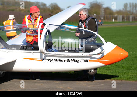 Shobdon airfield, Herefordshire UK - Busy day at Herefordshire Gliding Club on a day of perfect spring weather.Club members prepare a two seat Grob Twin Acro training glider for flight. Stock Photo