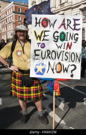 London, UK. 25th Mar, 2017. Anti-Brexit/ march for Europe demonstration, London. Banner 'How are we going to win Eurovision now?' held by man in colourful kilt. Credit: Maggie Sully/Alamy Live News Stock Photo