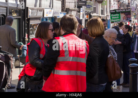 Labour party community action team helping out with crowd control at the  Save Our Schools protest on Eastgate Street in the city of Chester where protests are being held over the cuts to budgets and funding in English schools and education. Stock Photo